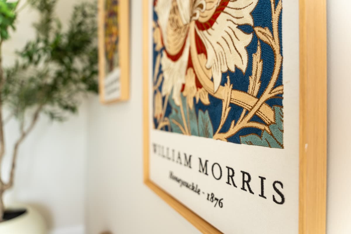 A framed William Morris print of a honeysuckle pattern